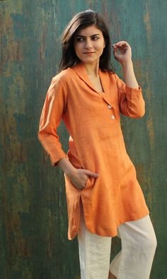 "Details:- - Tunic Length 35\" | 88 cm - Deep V-Neck Shawl collar - Shell buttons used in button placket - 3/4th sleeves Length 18\" | 46 cm with right side pocket - U-Shaped Hem with Side Slits Relax fit long tunic in pure linen Check the link below for my shop ---------------------------------------- https://www.etsy.com/in-en/shop/Magicsilvercraft https://www.etsy.com/in-en/shop/PehroDesig ---------------------------------------- ★★All the outfits are MADE TO ORDER you can share your demand f Summer Long Sleeve Kurta With Buttons, Long Sleeve Summer Kurta With Buttons, Orange Long Sleeve Kurta For Spring, Summer Long Sleeve Orange Kurta, Long Sleeve Orange Kurta For Summer, Orange Long Sleeve Kurta For Summer, Long Sleeve Orange Tunic For Summer, Collar Shirts For Women, Long Tunics For Women