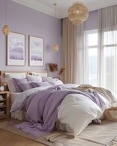 a bedroom with purple walls and white bedding in front of a large window on the floor