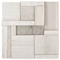 a white tile wall with squares and rectangles on the bottom, all in different shades