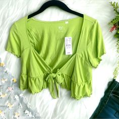 Pacsun Pac Cares Lime Green Cropped Top With Tie. Size Extra Small: Approx. 14.5” Underarm To Underarm, Approx. 13” Long. Size Small: Approx. 14.5” Underarm To Underarm, Approx. 13.5” Long. Size Medium: 16” Underarm To Underarm, Approx. 15” Long. 95% Rayon, 5% Spandex. Brand New. Spring Vacation V-neck Crop Top, Spring Crop Top For Day Out, Green Stretch Summer Crop Top, Green Stretch Crop Top For Summer, Summer Stretch Green Crop Top, Fitted Crop Top For Vacation In Spring, Fitted Crop Top For Spring Vacation, Fitted Crop Top For Spring And Summer, Summer Vacation Crop Top With Short Sleeves