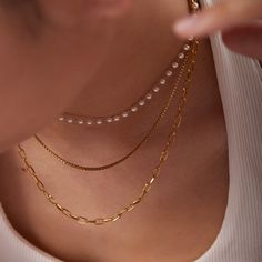 ✦ Complete your everyday look with our minimalist 18K gold-plated pearl layering necklace and earrings. Crafted with simplicity and elegance in mind, these pieces are perfect for adding a touch of sophistication to your casual and daily wear. Designed to seamlessly complement any outfit, they are versatile essentials for your jewelry collection.----------- DETAILS ------------ Color: Gold- Chain Length: 36cm & 40cm & 45cm + 5cm- Materials: 18K Gold Plated, 316L Stainless Steel, Seed Beads*316L S Pearl Layering, Three Layer Necklace, Mismatched Earrings Studs, Small Necklaces, Layer Necklaces, Layered Pearl Necklace, Multi Chain Necklace, 18k Gold Chain, Small Necklace