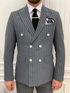 Impeccably tailored, our pinstripe double-breasted anthracite suit is a statement piece that will make you look dapper at any event. From the HolloMen fall-winter '22 collection. Suit Color: Anthracite The suit's fabric includes 65% Polyester, 32% Viscone, and 3% Lycra. Its jacket has a double-breasted collar, double slits, and flap pockets, and it is fully canvassed. Suit Care Instructions: Dry clean only In your package, we will include a jacket, pants, shirt, tie, and pocket square. Our model Fitted Double Breasted Suit With Pockets, Fitted Double Breasted Suit With Long Sleeves For Office, Fitted Double Breasted Long Sleeve Suit For Office, Fitted Double-breasted Suits With Long Sleeves, Fitted Double-breasted Three-piece Suit For Work, Winter Slim Fit Three-piece Suit With Long Sleeves, Semi-formal Slim Fit Double-breasted Suit, Slim Fit Long Sleeve Three-piece Suit For Winter, Winter Long Sleeve Slim Fit Three-piece Suit