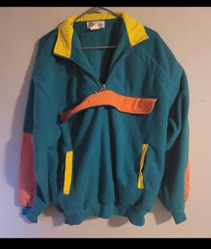 Vintage EATONs pullover  - Fleece material  - Neon  - Pastel colour block style  - Kangaroo pouch flap (no pocket) - Quarter Zip Up Size: L Good vintage condition  No rips or holes  No stains Green Fleece Sweatshirt With Pockets, Green Color Block Windbreaker For Winter, Sporty Multicolor Fleece Outerwear, Outdoor Fleece Color Block Outerwear, Outdoor Fleece Outerwear With Color Block, Outdoor Color Block Fleece Outerwear, Retro Long Sleeve Sweatshirt For Outdoor, Green Sweatshirt With Kangaroo Pocket For Outdoor, Green Half-zip Windbreaker For Winter