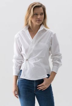 The CROP SHIRT is a cropped version of our classic men's shirt with just a few inches off the length. Worn two ways: buttoned up the front for a relaxed, classic fit, or wrapped across your torso to create a silhouette that follows the curves of your body. Constructed in PAPER COTTON, an exceptional 100% woven cotton fabric that is paper like to the touch and is the foundation for our solid colors. Knife Pleats, White Button Down, Classic Man, Woven Cotton, Crop Shirt, Turks And Caicos Islands, Trinidad And Tobago, Cotton Weaving, Scarf Accessory