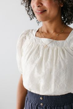 Introducing the beautiful 'Sybil' top, a delightful blend of elegance and grace! This top features dainty details that are sure to enhance any outfit. Pair with a smocked midi skirt and sandals for a feminine look or dress it up with a floral skirt and heels! Exclusively designed with you in mind. 100% Tencel Hand Wash Cold Do Not Bleach Hang or Lay Flat to Dry (Inside Out Only) Low Iron if Needed Do Not Iron Embroidery Fully Lined Model Height 5'9" | Wearing Size Small Model Height 5'8" | Wearing Size 1X Please carefully measure a similar item before placing your order to allow for the best fit and also to reduce the risk of returns. Have questions about fit? Call us! We try everything on, so we know how our clothes fit and we’re happy to assist you. Customer Service: 717.598.8309 9 AM - Elegant Top With Smocked Back And Square Neck, Elegant Tops With Smocked Back And Square Neck, Feminine Smocked Top For Brunch, Elegant Smocked Top For Brunch, Elegant Smocked Bodice Blouse For Brunch, Elegant Blouse With Smocked Bodice For Brunch, Elegant Smocked Bodice Top With Square Neck, Feminine Smocked Bodice Blouse With Square Neck, Feminine Smocked Top With Square Neck For Brunch