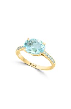 Aquamarine diamonds along the band match the oval-cut aquamarine center stone of this stunning 14k-gold ring. Total diamond weight: 0.18ct 14k-gold/aquamarine/diamond Made in the USA Oval Aquamarine Diamond Ring Fine Jewelry, Oval Aquamarine Diamond Ring In Fine Jewelry Style, Oval Aquamarine Diamond Ring With Prong Setting, Oval Aquamarine Diamond Ring With Accents, Oval Aquamarine Diamond Ring With Diamond Accents, Oval Aquamarine Ring With Diamond Accents, Oval Aquamarine Rings With Diamond Accents, Oval Yellow Gold Topaz Ring With Vvs Clarity, Oval Yellow Gold Topaz Ring With Diamond Accents