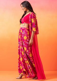 Fuschia Pink embellished choli paired with a floral printed cape jacket and printed draped skirt, finished with handmade tassels on the choli. Skirt With Jacket, Pink Floral Skirt, Cape Jacket, Fuschia Pink, Draped Skirt, Floral Printed, Floral Skirt, Pink Floral, Skirt Set