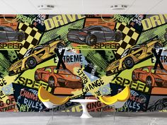 a large wall mural with racing cars on it