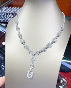 You'll never tire of wearing this unique and sophisticated eternity, Illusion diamond necklace. Stunningly set in 18K solid white gold, this breathtaking line of shimmering round & baguette diamonds necklace. So elegant, at 17.0-inch, this diamond necklace will take the viewers breath away. With over 10.21 cts. t.w. of sparkling, NATURAL, UNTREATED diamonds, all optimally cut to display maximum brilliant luster, this glamorous keepsake secures with a slide clasp lock as shown. The setting design Luxury Baguette Cut Necklace For Wedding, Exquisite Emerald Cut Diamond Necklace, Formal Platinum Jewelry With Baguette Diamonds, Dazzling Platinum Jewelry With Baguette Diamonds, Dazzling White Baguette Diamond Necklace, Formal Silver Solitaire Necklace With Baguette Cut, Silver Baguette Cut Solitaire Necklace For Formal Occasions, Fine Jewelry With Baguette Diamonds For Formal Occasions, Formal White Gold Jewelry With Baguette Diamonds