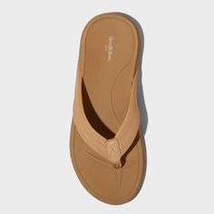 Lend cool appeal to your warm-weather outfits with these Ian Flip Flop Thong Sandals from Goodfellow & Co™. These flip flop sandals feature a thong strap to help keep them in place on your feet. They have an open-toe front and back for an airy feel, while the slip-on style makes them easy to put on and take off. Goodfellow & Co™: Where style & fit are always in good company. Casual Toe Post Flip Flops For Beach Season, Casual Brown Flip Flops For Beach Season, Adjustable Arch Support Flip Flops, Adjustable Arch Support Flat Flip Flops, Beige Flip Flops With Single Toe Strap For Beach, Beige Single Toe Strap Flip Flops For The Beach, Summer Outdoor Flip Flops With Single Toe Strap, Brown Synthetic Flip Flops For Beach, Comfortable Beige Toe Post Flip Flops