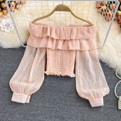 Cute tulle long sleeve topsFabric: blendedColor: pink, apricot, whiteSize(cm): free size (1inch=2.54cm)length 36cm bust 62-90cm sleeve lenegh 50cmPlease check the size carefully when you choose items.For more pictures of the dress, please contact us, thank you. Feminine Chiffon Tops For Fall, Summer Off-shoulder Top With Sheer Sleeves, Pink Fitted Tops With Sheer Sleeves, Feminine Long Sleeve Party Tops, Cute Long Sleeve Party Tops, Pink Ruffled Lantern Sleeve Tops, Trendy Long Sleeve Chiffon Top, Feminine Long Sleeve Beige Top, Pink Lantern Sleeve Tops With Ruffles