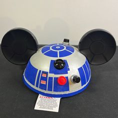 a mickey mouse ears hat with a star wars character on it