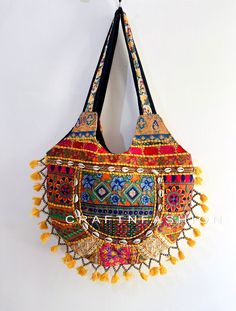 "Exclusive Bohemian Fashion Hand Patchwork Bag SIZE:  HEIGHT 17\" X WIDTH 18\" This Bag is made from hand embroidered Patch work which features multi color embroidered work, This Patch Work  shoulder bag is large enough to hold everything you need throughout your day, Made of antique hand-embroidered cotton Thread textiles, with intricate embellishments, each bag is truly unique NOTE : Product colour may slightly vary due to photographic lighting sources or your monitor settings." Cheap Multicolor Traditional Shoulder Bag, Rectangular Multicolor Embroidery Bag For Festivals, Handheld Multicolor Bags With Handwork, Multicolor Patchwork Tote Satchel, Traditional Handheld Bag With Multicolor Embroidery, Traditional Multicolor Embroidered Handheld Bag, Multicolor Shoulder Bag For Festivals, Handmade Tote Shoulder Bag For Festivals, Handmade Festival Hobo Tote Bag