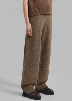 Color: Khaki Brown Midweight knitted fabric Relaxed fit Mid rise Straight leg Rib knit trim Back patch pocket Elasticated waist Slip on style Unlined 50% Acrylic 35% Polyamide 12% Wool 3% Span Dry Clean By Amomento. Imported Winter Full-length Pants With Ribbed Waistband, Casual Wool Pants For Loungewear, Winter Workwear Bottoms With Ribbed Waistband, Winter Wide Leg Pants With Ribbed Waistband, Winter Trousers With Ribbed Waistband, Winter Full-length Bottoms With Ribbed Waistband, Cozy Full-length Pants With Ribbed Waistband, Wool Bottoms With Pockets, Cozy Wide Leg Bottoms With Ribbed Waistband