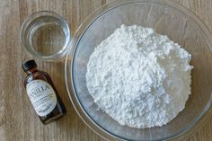 the ingredients to make this dish are in a glass bowl on top of a wooden table