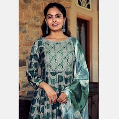 Design, style and pattern would be at the peak of your beauty once you dresses this green colored muslin anarkali suit. This suit comes along with muslin bottom and chiffon dupatta. The beautiful suit uniquely crafted with printed with gota patti work which makes this suit perfect for a woman. Women can buy this suit to wear for their upcoming functions, parties, sangeet wear. Team it with stylish accessories to make your looks more beautiful. Note:- The actual product may differ slightly in col Festive Green Floor-length Churidar, Unstitched Green Anarkali Palazzo Set, Green Semi-stitched Salwar Kameez For Navratri, Green Chanderi Churidar For Navratri, Green Anarkali Set With Resham Embroidery For Navratri, Festive Green Chanderi Anarkali Set, Semi-stitched Green Chanderi Anarkali Set, Green Semi-stitched Chanderi Anarkali Set, Semi-stitched Green Chanderi Churidar