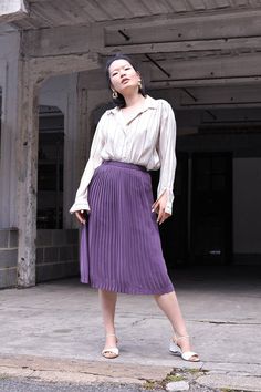 "Vintage high waist pleated skirt in a beautiful shade of lilac. It falls around the knees and has a zipper and snap button fastening. The model is 5'7 and size 8 (UK). MEASUREMENTS Waist: 61 cm / 24\" Hips: 91.5 cm / 36\" Length: 70 cm / 27.5\" In excellent condition. FREE UK SHIPPING on orders over £100 - use the code LUCKYUK at checkout." Spring Purple Pleated Skirt, Elegant Lavender Skirt For Spring, Chic Purple Pleated Skirt For Spring, Purple Pleated Maxi Skirt, Purple Flared Maxi Skirt For Spring, Elegant Purple Pleated Maxi Skirt, Elegant Purple Pleated Skirt, Purple Lined Pleated Skirt For Spring, Purple Pleated Bottoms For Spring