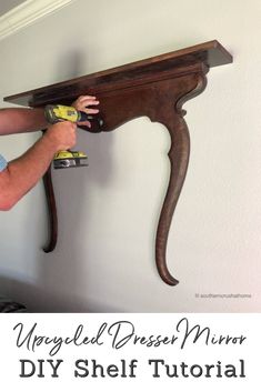 a man sanding down a wooden shelf with paint rollers on it and text overlay that reads, unpaved dresser mirror diy shelf tutor