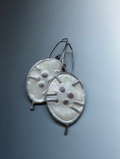 Silver dollar earrings. They shimmer with silver tones. Made of silver and polymer. They are 2.5 inches long and 1 inch wide. Thank you for looking! 🧡 Sand Dollar Earrings, Kyanite Earrings, Branch Necklace, Cambridge Ma, Button Necklace, Pink Topaz, Silver Dollar, Shell Earrings, Beach Jewelry