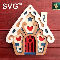 a wooden cutout of a house with hearts and stars on the door, in front of a red wood background