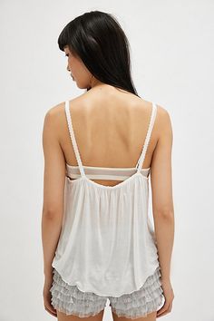 Featherweight fabric drapes effortlessly to form this flowy tank from Intimately. **Fit:** Flowy, full length **Features:** Semi-sheer featherweight fabrication, scoop neckline, skinny straps, picot trim, drapey style **Why We | On Air Tank Top by Intimately at Free People in White, Size: S White Camisole With Wide Straps For Summer, Feminine Beach Tank Top With Built-in Bra, Summer Tank Top With Delicate Straps For Loungewear, Sheer Camisole Tank Top For Spring, Sheer Camisole For Summer, Spring Sheer Tank Camisole, Sheer Tank Top With Tank Straps For Summer, Sheer Cami Tops For Summer, Sheer Tank Top For Summer