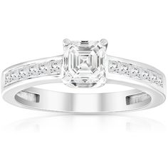 an engagement ring with a princess cut diamond in the center and channeled shoulders on each side