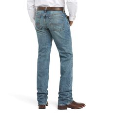 This is go-anywhere, do-anything denim. Ready to work hard or play hard, our relaxed-fit M2 has a stackable, boot-cut leg for a classic look. M2 Relaxed Legacy Boot Cut Jean | Men's M2 Relaxed Legacy Boot Cut Jeans in Granite, Size: 34 X 30 by Ariat Rugged Fitted Washed Jeans, Fitted Rugged Jeans In Medium Wash, Rugged Fitted Denim Jeans, Rugged Fitted Denim Blue Bottoms, Fitted Rugged Denim Blue Bottoms, Rugged Cotton Jeans With Belt Loops, Rugged Fitted Blue Jeans, Fitted Rugged Blue Jeans, Blue Rugged Fitted Jeans