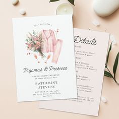 two wedding programs on top of each other next to some flowers and candles in front of them