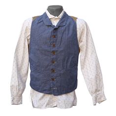 *This item is eligible for exchange or store credit only, no refunds. SPECS * An original MFSC®, inspired by late 1800’s gents’ waistcoats. * Fabric: 6.5 oz. 100% cotton indigo dyed denim 2×1 twill, solid white selvedge. * High buttoned, small fold lapel, slim snug silhouette. * Intricate early waistcoat panel construction. Tailor made style. * Adjustable back cinch strap with French New Old Stock (NOS) metal slide buckle. * Eight button front, brown corrozo wood, aka ‘coconut wood’. * Two fron Denim Waistcoat, Dyed Denim, Velvet Vest, Coconut Wood, Metal Slide, French Silk, Vintage Inspired Outfits, Vest Pattern, Indigo Dye