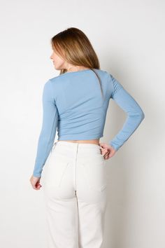 This sculpt knit top has your outfit goals covered--it's light blue hue brings the sky's vibrancy to your wardrobe and its bodycon fit shows off your silhouette with style and grace. Long sleeves and a scoop neckline complete the look with a hint of elegance. It's the perfect top to wear as the seasons change! Materials: 90% Polyamide and 10% Spandex All sale items are considered final sale. Blue Top Outfit, Light Blue Top, Seasons Change, Adhesive Bra, Style And Grace, Outfit Goals, Blue Top, The Seasons, Changing Seasons