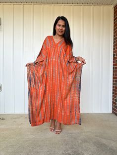 This kaftan, made from rayon fabric and hand dyed, is versatile for many occasions. It complements all body types with its long, hangs loose design and slits up both sides. It can be worn in many different stylish ways to make you look your best! DETAIL • All measurements are flat• Bust/ Waist/ Hips 34 in. (Circumference 68 in.)• Arms 11 in. (Circumference 22 in.)• Length 50 in. The model wear • V-Neck • Side slits• No pocket• Slipover style• All above measurement are flatFABRIC• 100% Rayon FIT• Rayon V-neck Kaftan For Beach Cover-up, V-neck Rayon Kaftan For Beach Cover-up, Flowy Natural Dye Maxi Dress, Flowy Maxi Dress With Natural Dye, Hand Dyed Maxi Dress, Tie Dye Long Kaftan Free Size, Long Tie Dye Kaftan Free Size, Flowy Tie Dye Kaftan Tunic, Flowy Tie-dye Tunic Kaftan