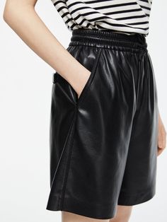 Details: PU coating shorts in black Elastic waistband with drawstring 3-pocket styling Relaxed fit Pair with 'Original' PU Shacket Materials & Care: 100% Polyester Hand Wash only Do not dry clean Do not bleach Size & Fit: Model is 5'7", Bust 32, Waist 24, Hips 35, wearing a size S Item #: LL3PA21 Luxury Chic Leather Shorts, Sleek Leather Shorts, Leather Shorts With Built-in Shorts, High-waisted Leather Shorts With Belt Loops, Leather Shorts Farfetch, Short Cuir, Leather Shorts, Chic Me, Jean Shorts