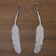 Andi Rachmansyah transforms bone carved by hand into exquisite earrings. The pale feathers suggest a dove's gift of peace and dance on silver hooks. .925 Sterling silver hooks Angel Wing Gifts, Crow Feather, Dove Jewelry, Theme White, Floral Pendant Necklace, Bone Earrings, Cow Bones, Hamsa Pendant, White Dove