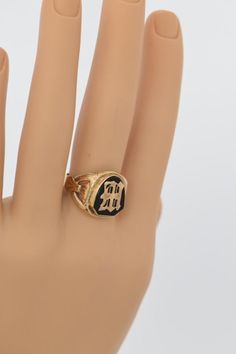 "This is a 10K Yellow Gold Black Onyx signet ring with a \"W\" or \"M\". Circa 1940, carved sides, shield shaped black onyx on flat cabochon, size 11 3/4, weight 7.0 grams. Stock # BB84R10" Classic Black Initial Ring For Formal Occasions, Classic Black Round Initial Ring, Black Engraved Initial Ring For Anniversary, Black 14k Gold Engraved Signet Ring, Black 14k Gold Hallmarked Engraved Ring, Classic Black Engraved Ring Stamped 14k, Classic Black Engraved Ring With Black Enamel, Black Engraved 14k Gold Ring, Victorian Black Signet Ring Stamped 14k