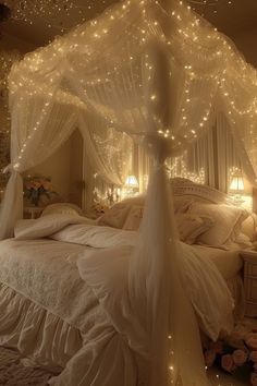 a bed with white sheets and lights on the headboard is in a room that looks like it has been decorated for christmas