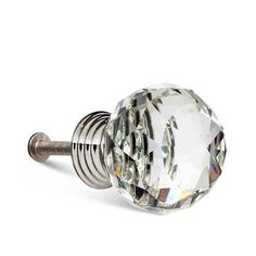 a glass door knob with a diamond design on the front and back end, is shown