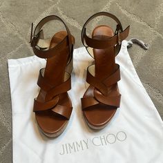 New In Box Jimmy Choo Size 39 Brown Vachetta Leather. Cork Wedge. Gold Hardware. White Espadrilles, Peep Toe Sandals, Wedge Heel Sandals, Leather Wedge Sandals, Suede Wedges, Jimmy Choo Shoes, Womens Wedges, Leather Wedges, Womens Shoes Wedges