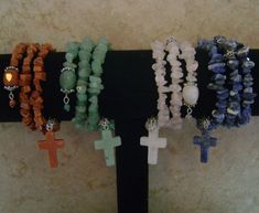 "This is a \"Brand New\" Beaded  Semi-Precious Stone Rosary Religion/Spiritual Beaded Cuff Charm Bracelet. You Choose Your Beaded Bracelet Color Stone! Sodalite/Blue, Aventurine/Green, Rose Quartz/Pink, or Gold Stone. Matching Semi-Precious Stone Cross Charm, One Size, Silver-tone Metal Components, Adjustable Stainless Steel Silver Memory Wire Wrap Around Wrist Design Bracelet. Handmade By HeatherMarie.  ~ SODALITE PROPERTIES:  A Stone for the Creative Type. Emotional Balancing and Calming, Clea Spiritual Hand Wrapped Rosary Bracelet For Healing, Spiritual Hand-wrapped Rosary Bracelet For Healing, Rose Quartz Properties, Quartz Pink, Rose Gold Quartz, Bracelets Design, Jewelry Design Inspiration, Beaded Cuff Bracelet, Hematite Stone