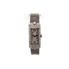 Antique Art Deco Diamond Watch in Platinum & 18k This Art Deco antique manual wind watch is an antique blend of platinum and 18 karat white gold, showcasing the opulence of its era. The watch features a rectangular face adorned with meticulously set diamonds, creating a brilliant display. The primary diamond, an old European cut weighing .12 carats, has SI2 clarity and I color. The accent diamonds, totaling .87 carats, number 46 in all, each measuring 1.65 mm and weighing .019 carats. These diamonds are arranged beautifully, enhancing the watch's milgrain and filigree details, hallmarks of the Art Deco style.  The watch's mesh bracelet, crafted from white gold, complements the platinum watch face perfectly, providing a seamless and elegant look. While the watch is in working condition, due Luxury Rectangular Art Deco Watches, Art Deco Platinum Evening Watches, Platinum Art Deco Evening Watches, Antique Platinum Evening Watches, Antique Platinum Jewelry And Watches For Evening, Platinum Diamond Watch With 17 Jewels For Evening, Vintage Diamond Watch With Diamond Hour Markers For Evening, Art Deco Platinum Watch For Anniversary, Art Deco Evening Watch With Diamond Hour Markers