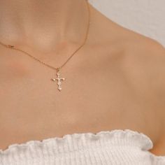 This gold cross necklace is made of 18K gold-plated brass. The necklace includes a beautiful cross pendant in cubic zirconia. This minimalist cross necklace is easy to wear everyday in any occasion. Crucifix Clavicle Chain Jewelry For Gift, Crucifix Clavicle Chain Jewelry Gift, Crucifix Cross Necklace With Clavicle Chain As Gift, Gift Crucifix Necklace With Clavicle Chain, Crucifix Charm Necklaces For Gifts, Gift Crucifix Charm Necklace, Gift Cross Pendant Necklace With Clavicle Chain, Gift Cross Necklace With Clavicle Chain, Crucifix Cross Necklace With Adjustable Chain