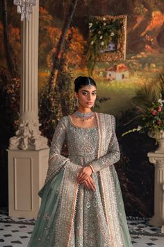 Pakistani Bridal Dress in Pishwas and Lehnga Style is a perfectly stitched attire that comes in premium quality fabric. This stunning Pishwas Dress is adorned with lavish designs and hand-crafted details of zardosi and embroidery work, making it an epitome of beauty and grace. Pakistani Bridal Lehenga, Bridal Maxi Dress, Pakistani Bridal Dress, Pengantin India, Raw Silk Lehenga, Pakistani Designer Clothes, Pakistani Wedding Outfits, Lehenga Style, Bridal Dress Design