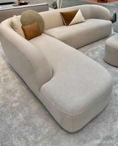 a couch and ottoman on display in a store