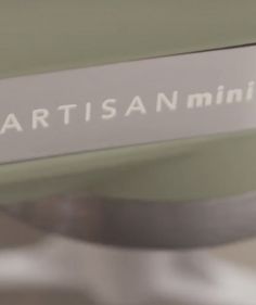 a close up view of the nameplate on an electronic device that is being used by artisan minis