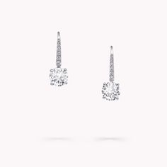 Elegantly set upon pavé diamond swan hooks, the unrivalled brilliance of a round diamond is celebrated with our round diamond earrings. The essence of timeless classicism, the simple setting of the stones, with minimal metal on display, amplifies and enhances their scintillating beauty. The Classic Graff collection celebrates the purity and fire of the finest Graff diamonds showcased in eternally elegant silhouettes. Model wears an elegant pair of Classic Graff round diamond earrings with a tota Graff Aesthetic, Graff Earrings, God Jewelry, Graff Jewelry, Earrings Platinum, Graff Diamonds, Round Diamond Pendant, Round Diamond Earrings, Diamond Wedding Jewelry