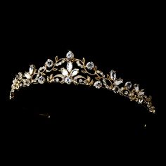 Gold Plated Scroll Wedding TiaraThis stunning tiara has a modern vintage design. The light gold plated floral scroll design is accented with brilliant crystal rhinestones for just the right amount of sparkle. This headpiece will be a  beautiful finishing touch to your elegant bridal look.Size: The decorated portion of the piece measures 8" wide and 1" tall. Color: Gold/Clear.Style: hp8312g.Also available in silver plating as hp8312.Available with matching jewelry set as 8312.Please allow 1 week Golden Headpiece, Crown Aesthetic, Simple Wedding Flowers, Crystal Tiara, Beautiful Tiaras, Gold Tiara, Headpiece Jewelry, Accesories Jewelry, Light Style