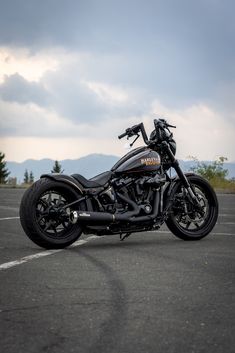 a black motorcycle parked in a parking lot