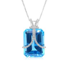 Make a statement with our Unique Cut Blue London Topaz Pendant Necklace. This necklace sits beautifully on your neck giving a striking look from its emerald cut blue topaz center stone wrapped by two embellished ribbons leading into a unique, hand crafted, adorned bail. The gemstone lays atop an 18K white gold elevated filigree style setting for extra detail. 
33.06 carat Emerald cut natural London Blue Topaz
0.50 carat pave diamond setting
18k white gold
The Pendant design can be London Topaz, Blue Topaz Pendant Necklace, Blue Topaz Pendant, Topaz Pendant, Family Jewels, Stone Wrapping, Orange Sapphire, Diamond Settings, Tennis Bracelet Diamond