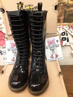 These are a now deleted model of Dr Martens boots. These 14 hole boots are finished in black Patent leather and have a heel that you'll find very comfortable too wear on a daily basis. They have a cushioned sole and footbed. They also have a side zip for ease of use. These are a UK size 5, European 38, ladies USA 7 Alternative Style Black Boots With Round Toe, Black Round Toe Alternative Boots, Alternative Style Fitted Boots With Round Toe, Alternative Style Black Knee-high Boots, Alternative Black High Ankle Lace-up Boots, Black Knee-high Lace-up Boots Alternative Style, Fitted Knee-high Black Combat Boots, Alternative Style Black High Ankle Lace-up Boots, Black Fitted Knee-high Combat Boots