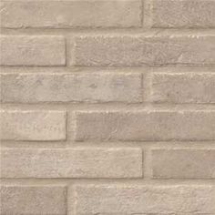 a white brick wall with no mortars or mortars on the bottom and sides