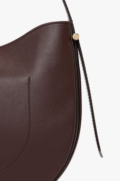 Elevate your everyday style with the Victoria Beckham Hobo Bag in burgundy, where timeless sophistication meets practical design. Crafted from the finest supple leather, this bag offers a relaxed silhouette that embodies understated luxury. Its slouchy, yet structured shape drapes beautifully whether worn over the shoulder or carried by hand, offering a versatile, casual-chic look. Victoria Beckham Medium Dia Hobo Bag In Burgundy Smooth Leather  - Size ONE SIZE UK Classic Top Handle Hobo Bag For Business, Classic Calf Leather Hobo Shoulder Bag, Classic Hobo Bag In Calf Leather With Leather Lining, Elegant Cognac Hobo Bag With Leather Lining, Classic Crossbody Hobo Bag With Leather Lining, Classic Leather Lining Crossbody Hobo Bag, Burgundy Leather-lined Crossbody Shoulder Bag, Classic Calf Leather Hobo Bag With Leather Lining, Classic Hobo Bag With Leather Handles For Work